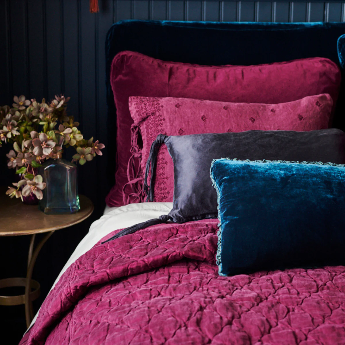 Jewel tone fabrics and luxurious bedding